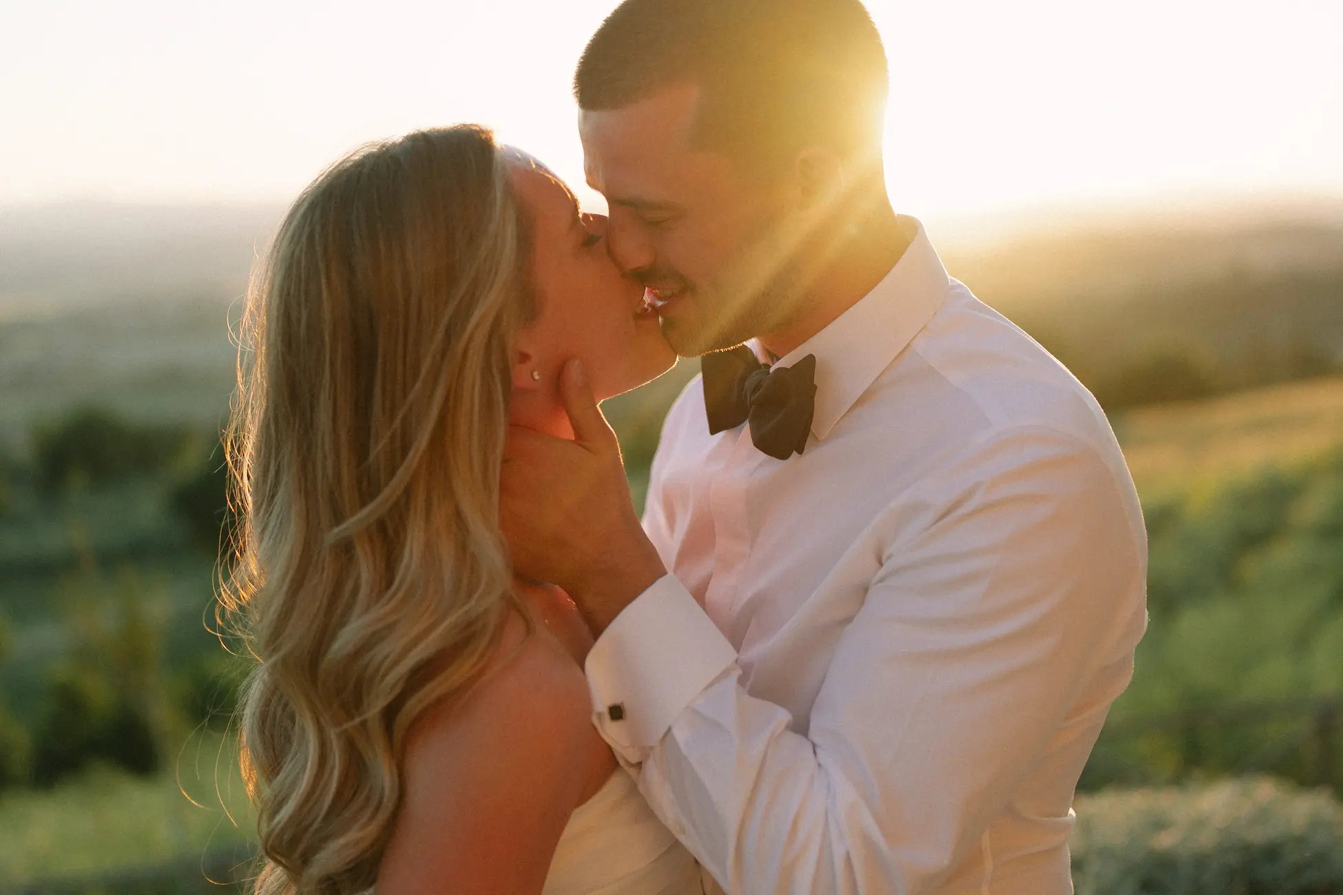 Destination wedding in Umbria -- Castello di Reschio medieval fortress green hills and Sagrantino vineyards