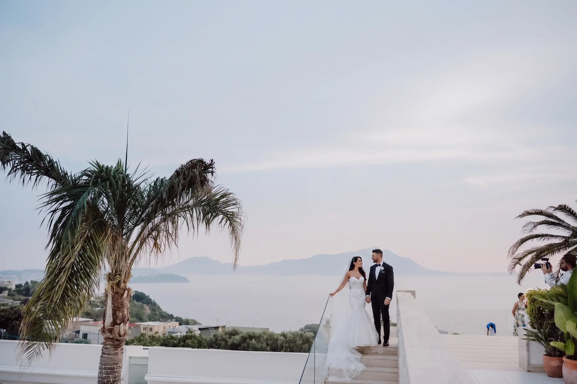Destination wedding in Procida, Italy — pastel-coloured houses of Marina di Corricella and the Gulf of Naples