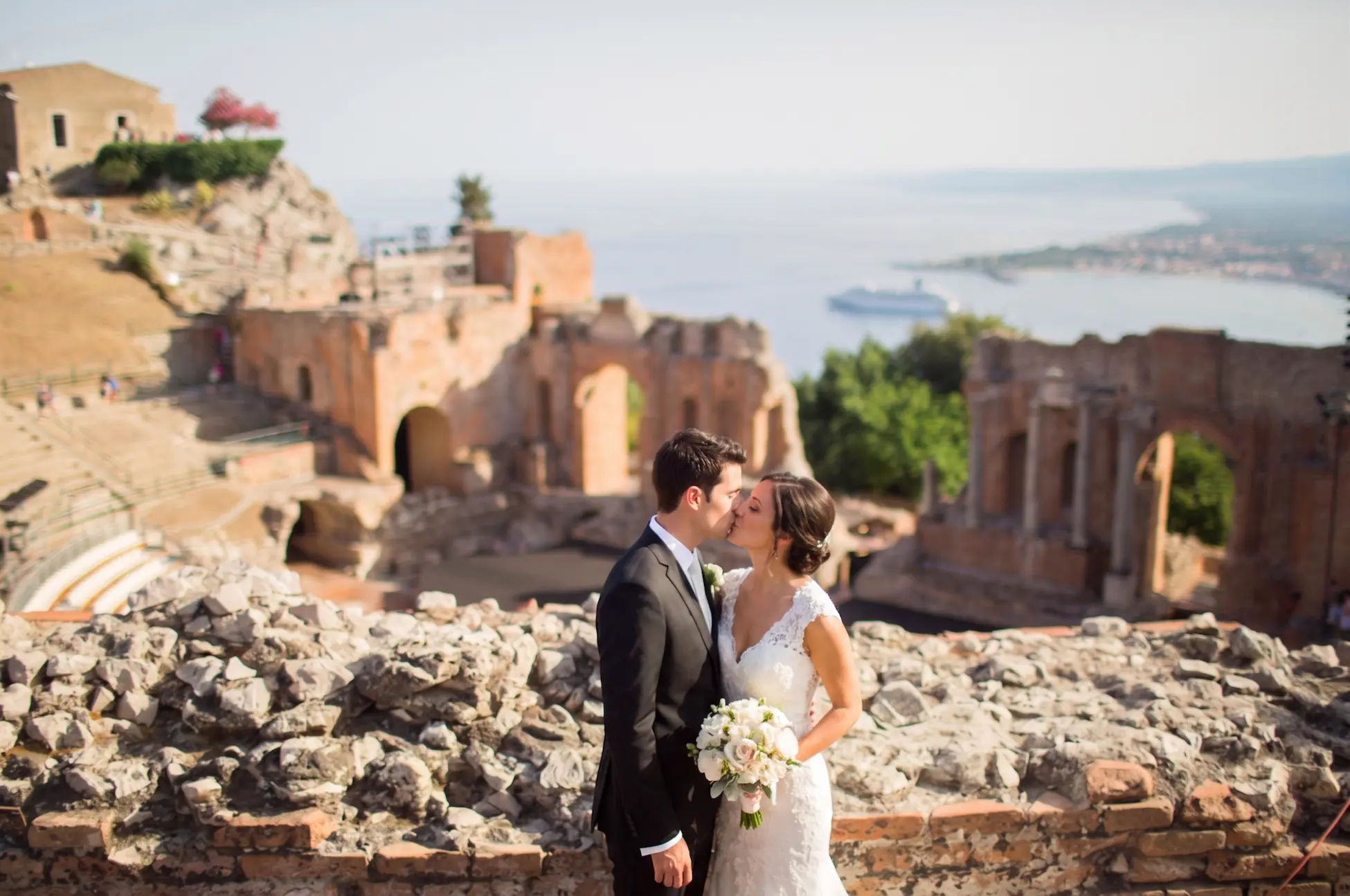 Wedding couple in Taormina, Sicily, with Mount Etna and the Mediterranean Sea in the background